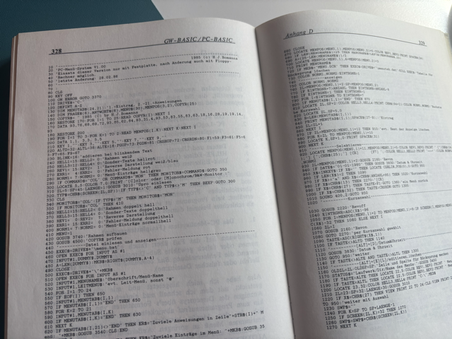 An open GW-BASIC / PC-BASIC book showing two pages of program listings